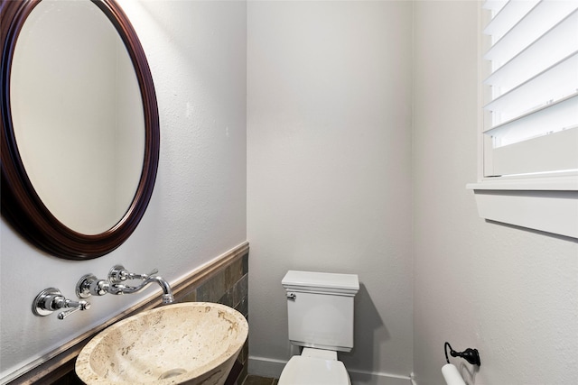 bathroom featuring toilet and a sink