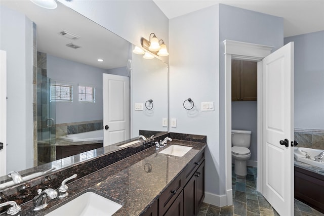 bathroom featuring a garden tub, a sink, and a shower stall