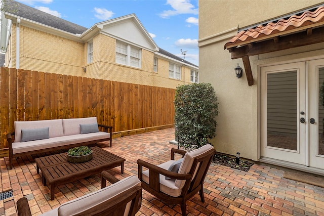 view of patio / terrace featuring fence and an outdoor living space