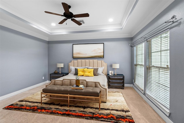 carpeted bedroom featuring visible vents, baseboards, a raised ceiling, ornamental molding, and recessed lighting