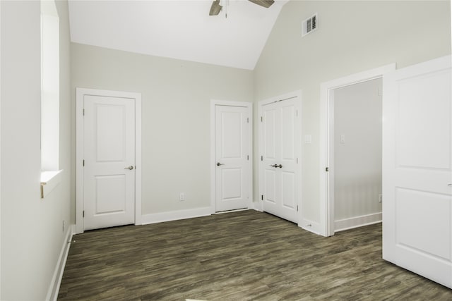 unfurnished bedroom featuring dark wood finished floors, visible vents, a ceiling fan, high vaulted ceiling, and baseboards