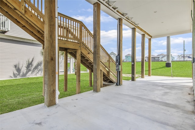 view of patio featuring stairs and a residential view