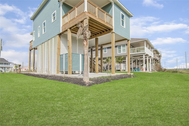 back of house featuring stairs, a deck, a patio, and a yard