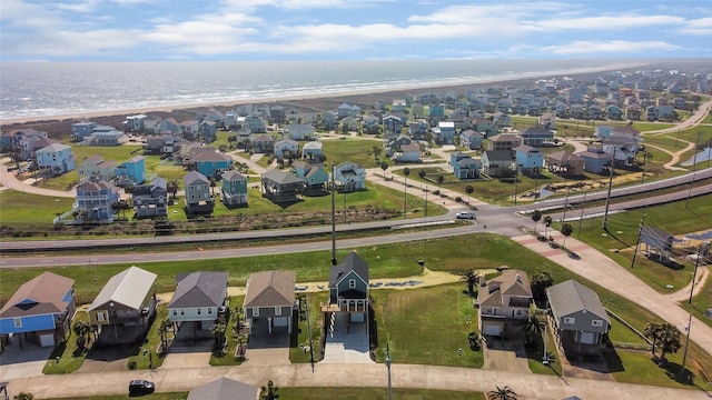 birds eye view of property with a water view and a residential view