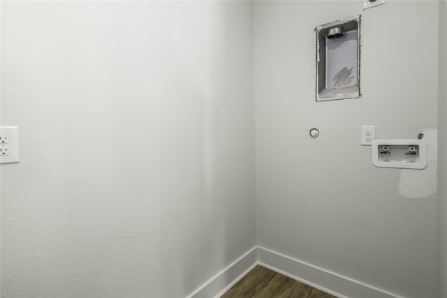 clothes washing area with hookup for a washing machine, laundry area, dark wood finished floors, and baseboards