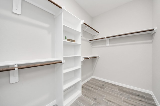 walk in closet featuring wood tiled floor