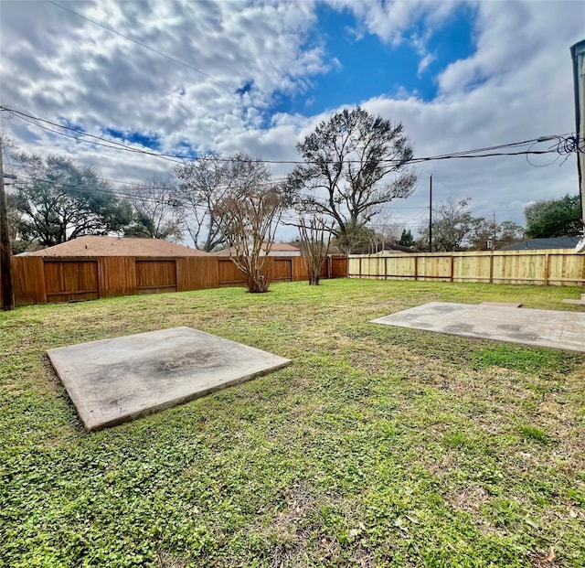 view of yard with a fenced backyard and a patio