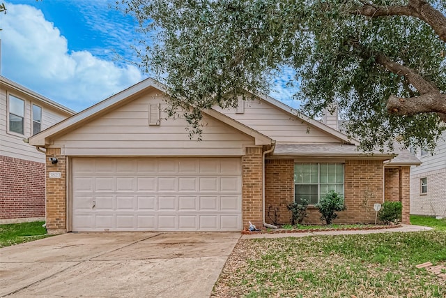 ranch-style house featuring a garage, driveway, and brick siding