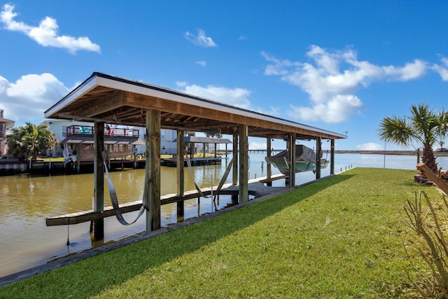 view of dock with a water view, boat lift, and a lawn