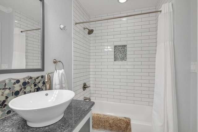 full bathroom featuring vanity and shower / tub combo with curtain