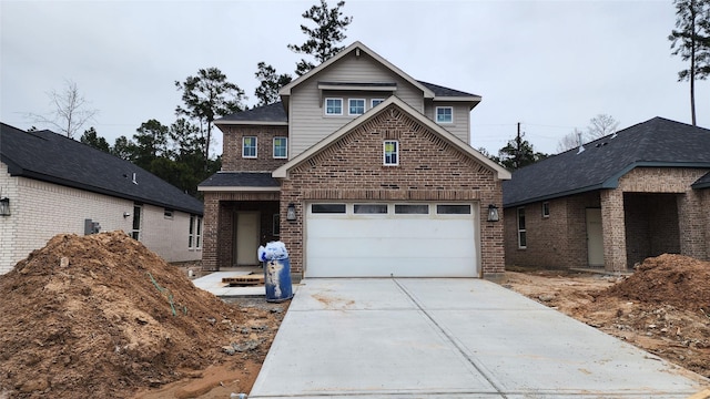 view of front of house with a garage, driveway, and brick siding