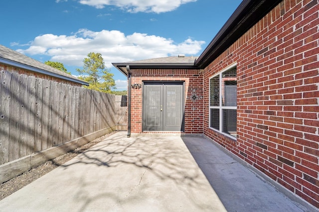 view of patio featuring fence