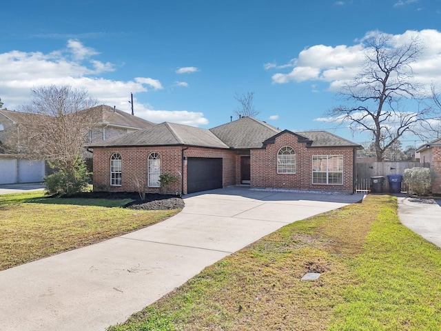 view of front of home with a garage, brick siding, a shingled roof, concrete driveway, and a front yard