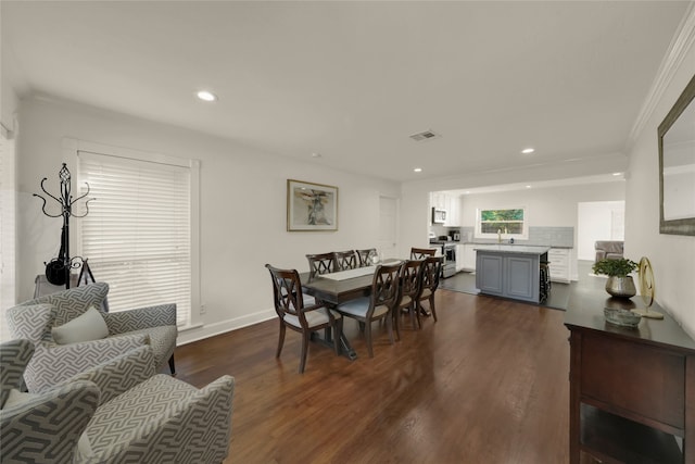 dining room with baseboards, dark wood finished floors, visible vents, and recessed lighting