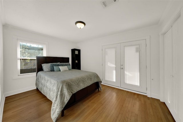 1931 Ansbury Dr, Houston, TX 77018 - bedroom with baseboards, visible vents, french doors, and hardwood / wood-style floors