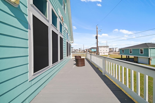 wooden deck with a residential view