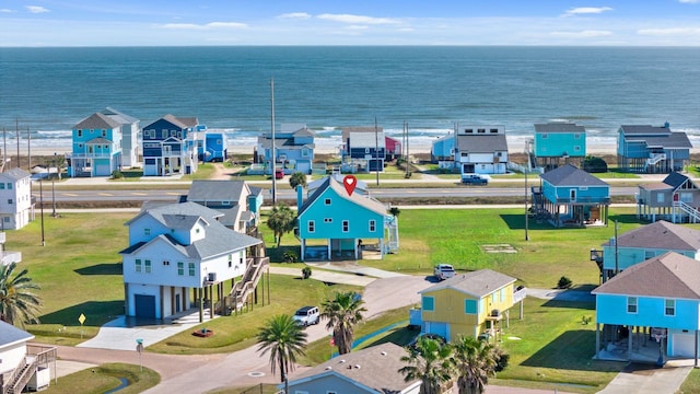 drone / aerial view featuring a water view and a residential view