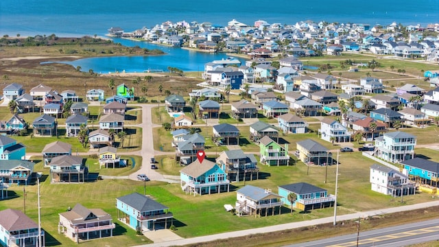 birds eye view of property featuring a residential view and a water view