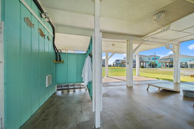 view of patio / terrace featuring a residential view and visible vents