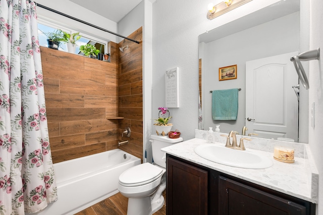 full bath with toilet, shower / bath combo, wood finished floors, and vanity