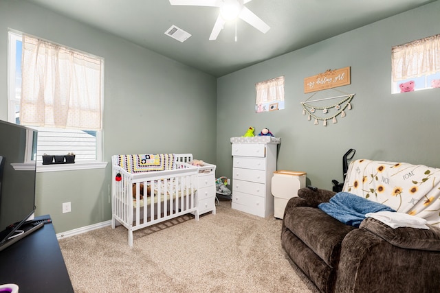 carpeted bedroom with visible vents and ceiling fan