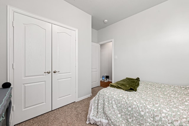 bedroom featuring a closet and carpet flooring