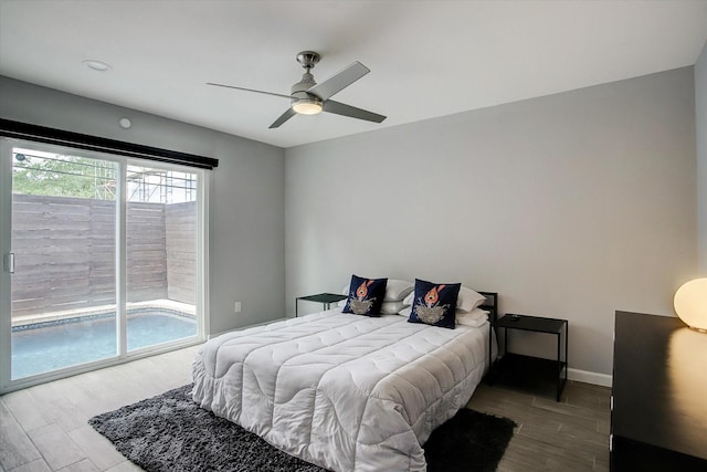 bedroom with baseboards, wood finished floors, a ceiling fan, and access to exterior