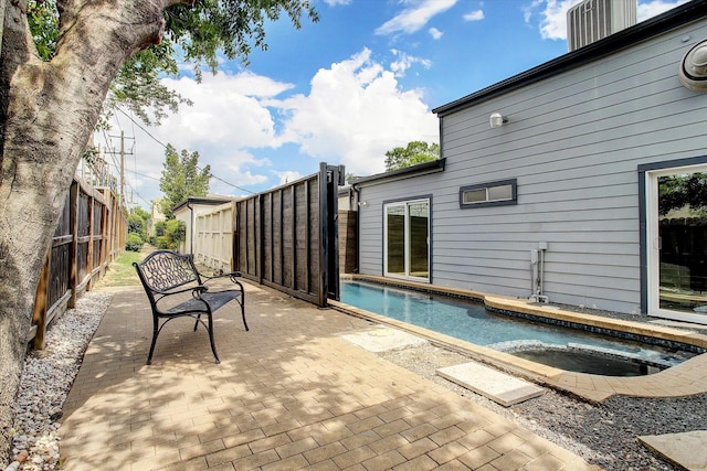 pool featuring a patio area and fence