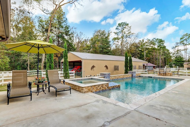 view of pool with a fenced in pool, an outbuilding, a patio area, fence, and an in ground hot tub