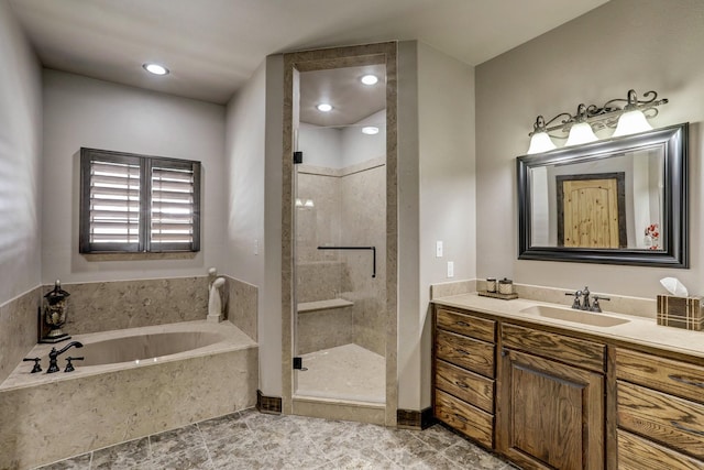 bathroom with a stall shower, tile patterned floors, a bath, and vanity