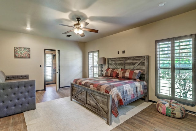 bedroom with recessed lighting, wood finished floors, visible vents, and a ceiling fan