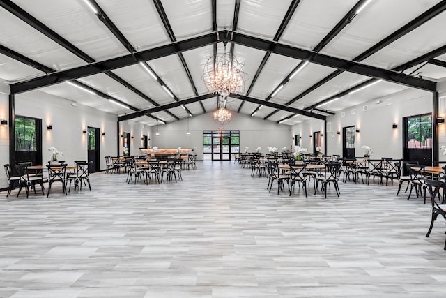 dining area with a chandelier and high vaulted ceiling