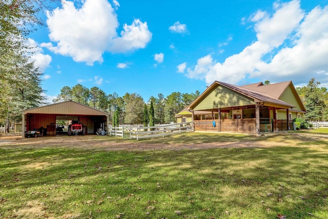 surrounding community featuring a carport, an outbuilding, an exterior structure, and driveway