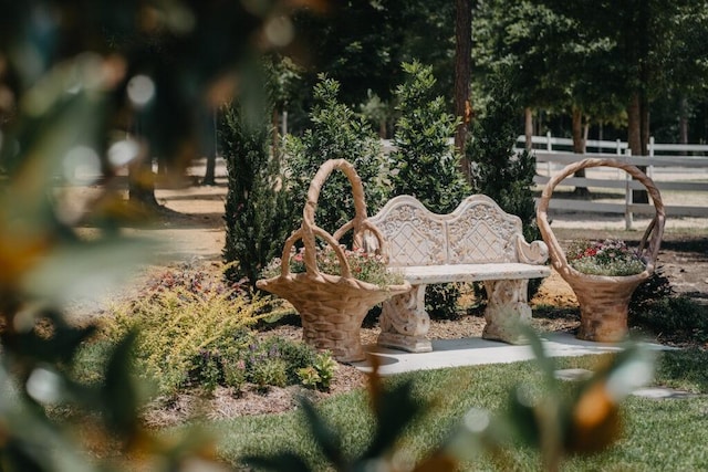 view of community with fence