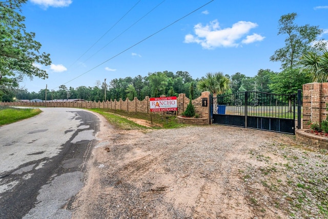 view of street featuring a gate