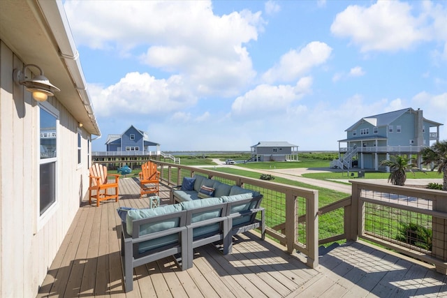 deck with a yard and an outdoor living space