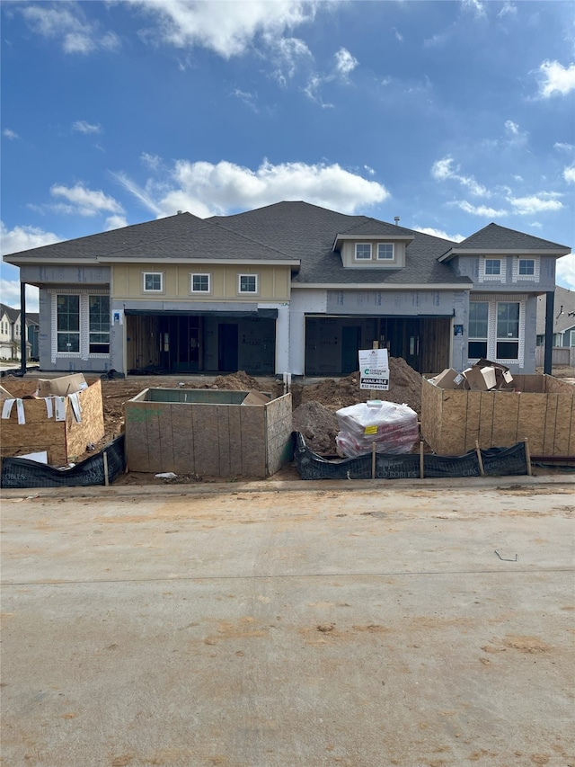 view of front of house featuring fence