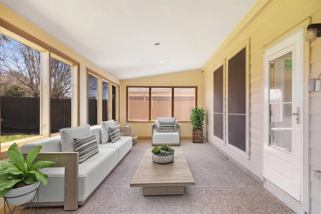 sunroom featuring lofted ceiling