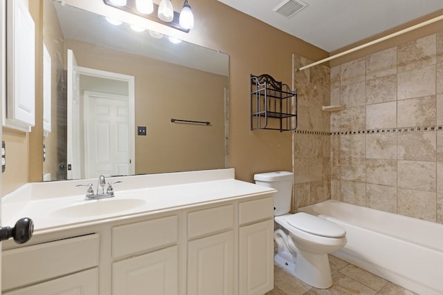 bathroom featuring toilet, vanity, visible vents, shower / washtub combination, and tile patterned floors