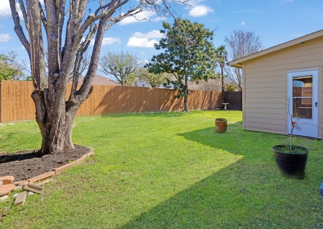 view of yard with a fenced backyard