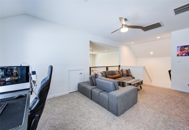 office featuring lofted ceiling, carpet flooring, and visible vents