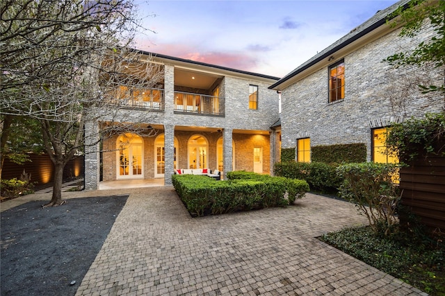 back of house with a balcony