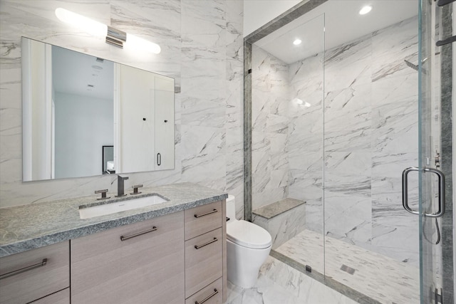 bathroom with a marble finish shower, toilet, marble finish floor, vanity, and recessed lighting