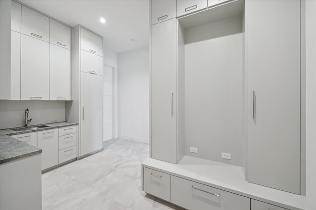 interior space with recessed lighting and a sink