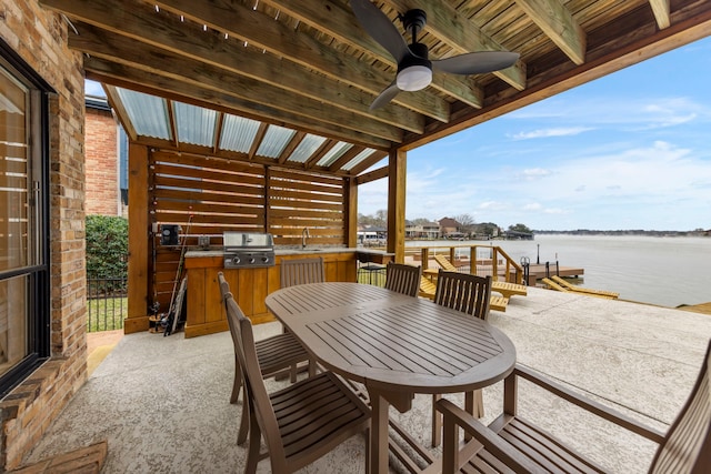 53 La Costa Dr, Montgomery, TX 77356 - view of patio / terrace featuring a water view, a sink, a ceiling fan, a boat dock, and grilling area
