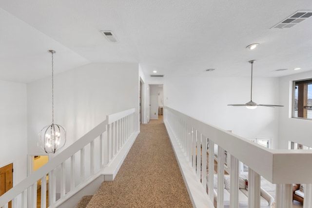 53 La Costa Dr, Montgomery, TX 77356 - corridor with a chandelier, vaulted ceiling, carpet, and visible vents