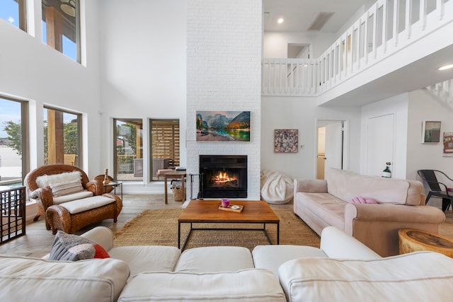 53 La Costa Dr, Montgomery, TX 77356 - living area with a brick fireplace and wood finished floors