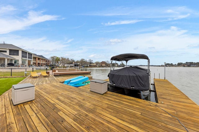53 La Costa Dr, Montgomery, TX 77356 - view of dock featuring a water view, a residential view, and fence