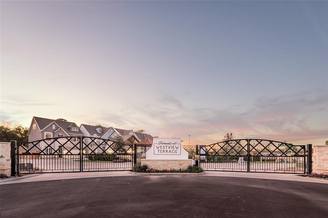 view of gate with fence