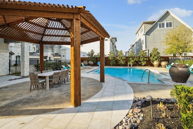 view of pool with a patio, outdoor dining area, a fenced backyard, a residential view, and a fenced in pool